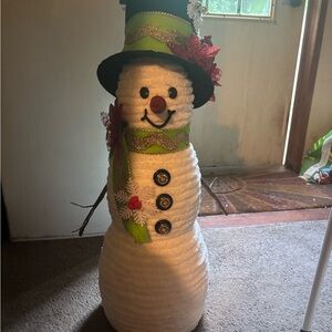 Festive Snowman Decoration with Green Hat and Red Accents